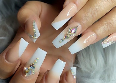 Elegant nail art with crystals at MiLinda519, Savannah, Georgia, US, showcasing intricate designs.
