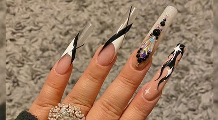 Exquisite long nail art design showcasing intricate details at MiLinda519, Savannah, Georgia, US.