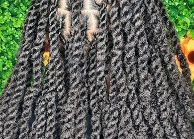 Stylish black twisted hair at Niva Creations, Saint Michael, Saint Michael, BB, surrounded by green foliage.