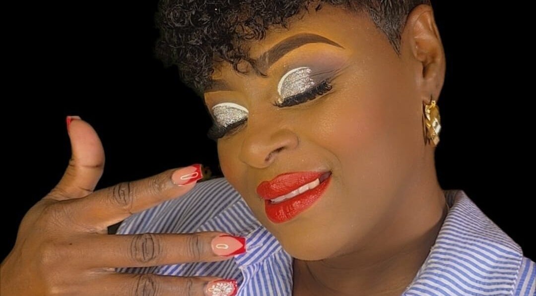 Elegant woman with glittery makeup and red nails at Niva Creations, Saint Michael, Saint Michael, BB.