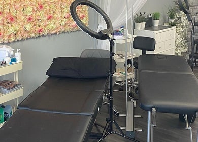 Lashes by BW in Atherstone, England, GB features a chic beauty room with elegant floral decor and modern furnishings.