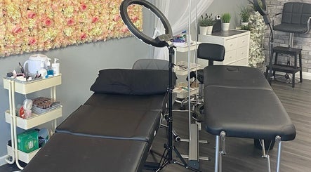 Lashes by BW in Atherstone, England, GB features a chic beauty room with elegant floral decor and modern furnishings.