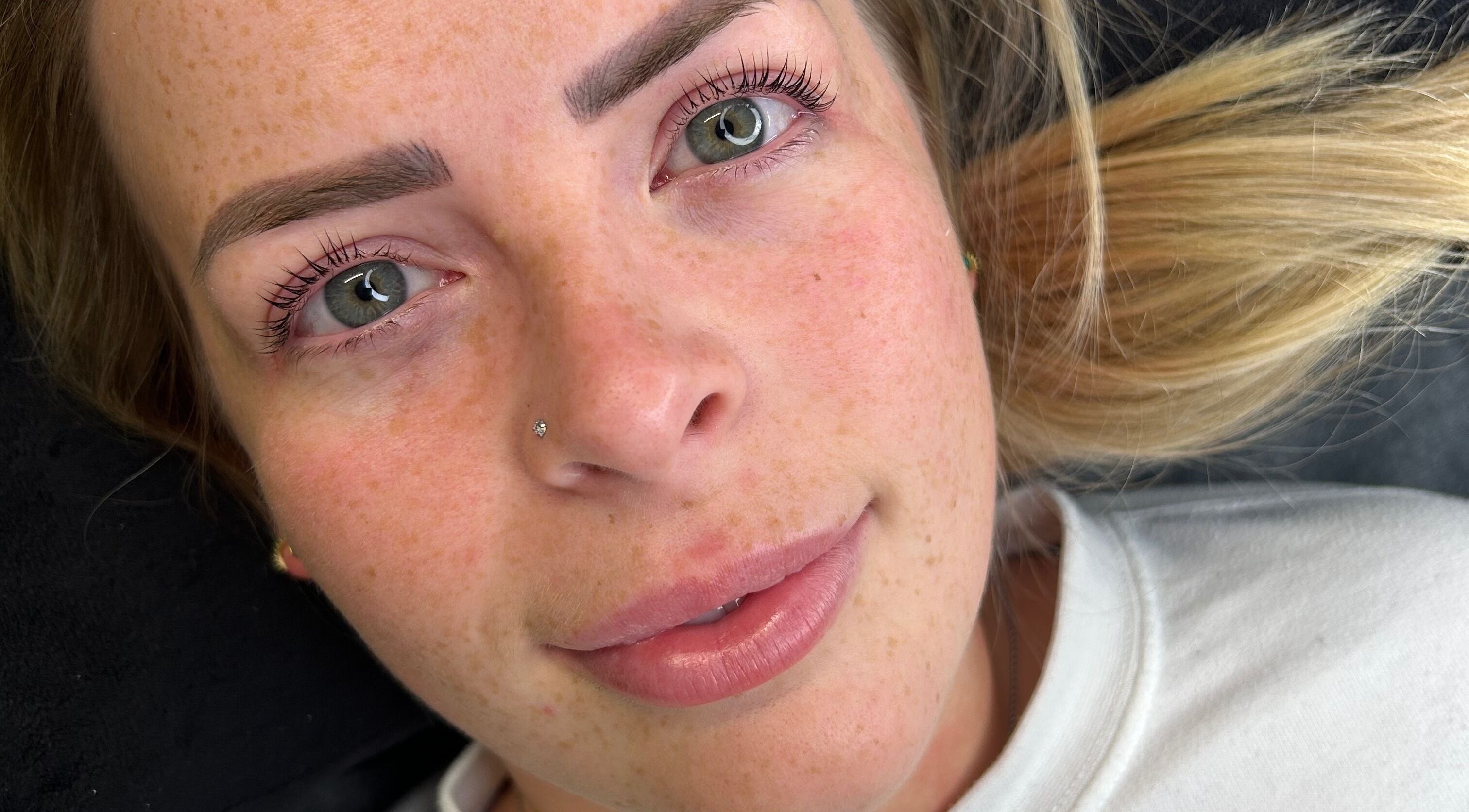 Woman showcasing enhanced lashes at Lashes by BW, Atherstone, England, GB.