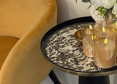 Elegant candles on a stylish table at MBeauty, Dublin, County Dublin, IE, create a warm, welcoming atmosphere.