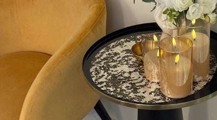 Elegant candles on a stylish table at MBeauty, Dublin, County Dublin, IE, create a warm, welcoming atmosphere.