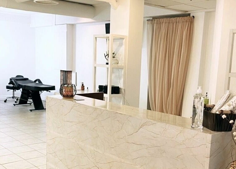 Reception area with marble counter at Simah Salon, St. Catharines, Ontario, CA.