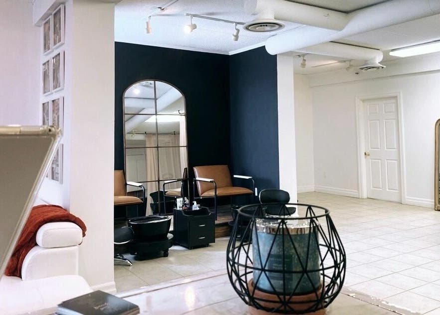 Interior of Simah Salon in St. Catharines, Ontario, CA, featuring a modern design with stylish décor and seating.