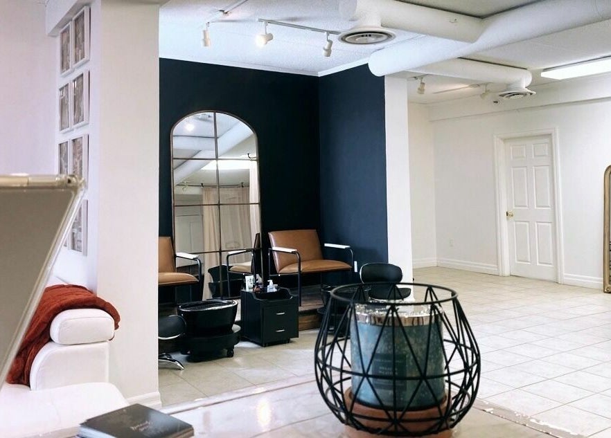 Interior of Simah Salon in St. Catharines, Ontario, CA, featuring a modern design with stylish décor and seating.