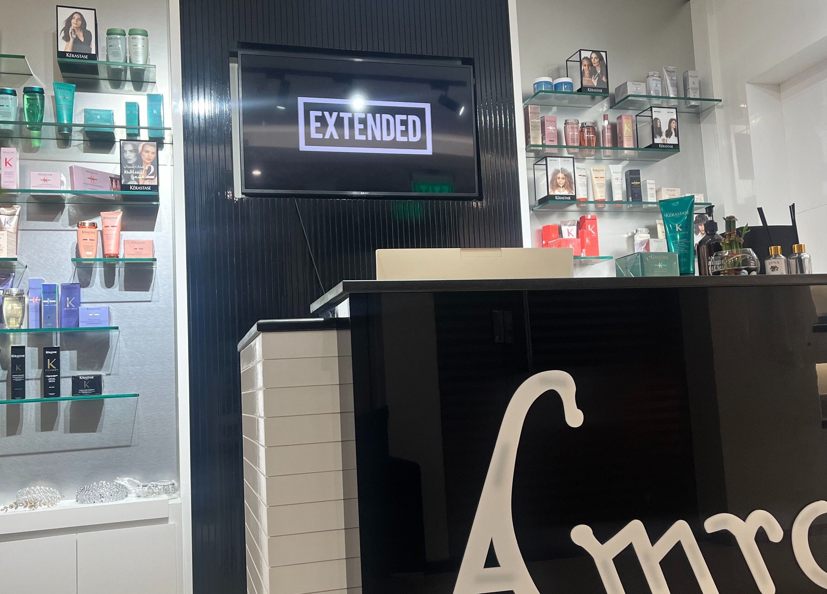 Interior of Amro Ladies Salon - Chedi Branch in Muscat showcasing luxury hair products on stylish shelves.