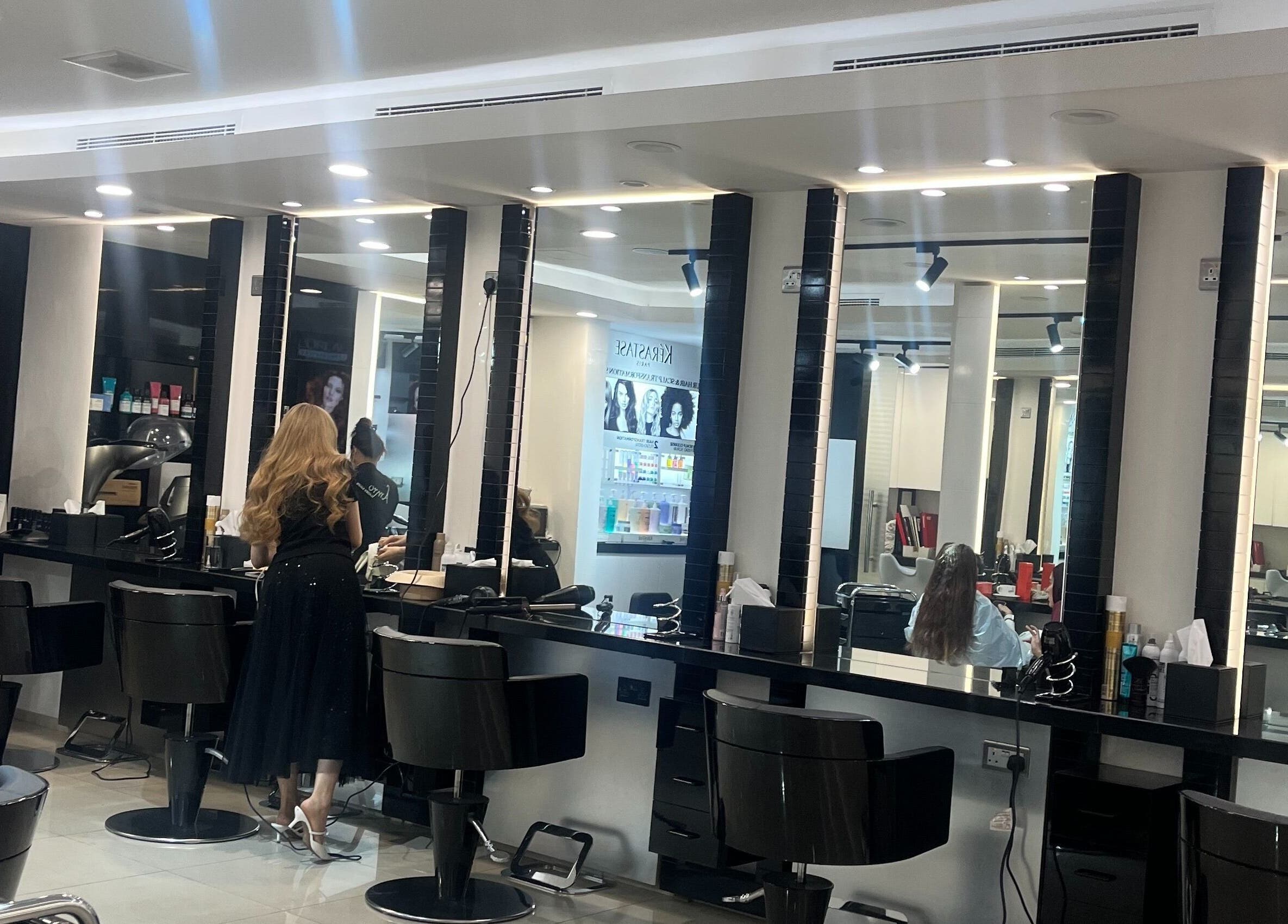 Interior of Amro Ladies Salon - Chedi Branch, Muscat, showcasing modern styling stations.