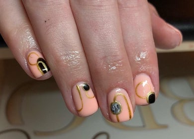 Elegant nail art with gold accents at A K Beauty @ The Salon, Kempston, England, GB.