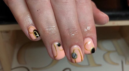 Elegant nail art with gold accents at A K Beauty @ The Salon, Kempston, England, GB.