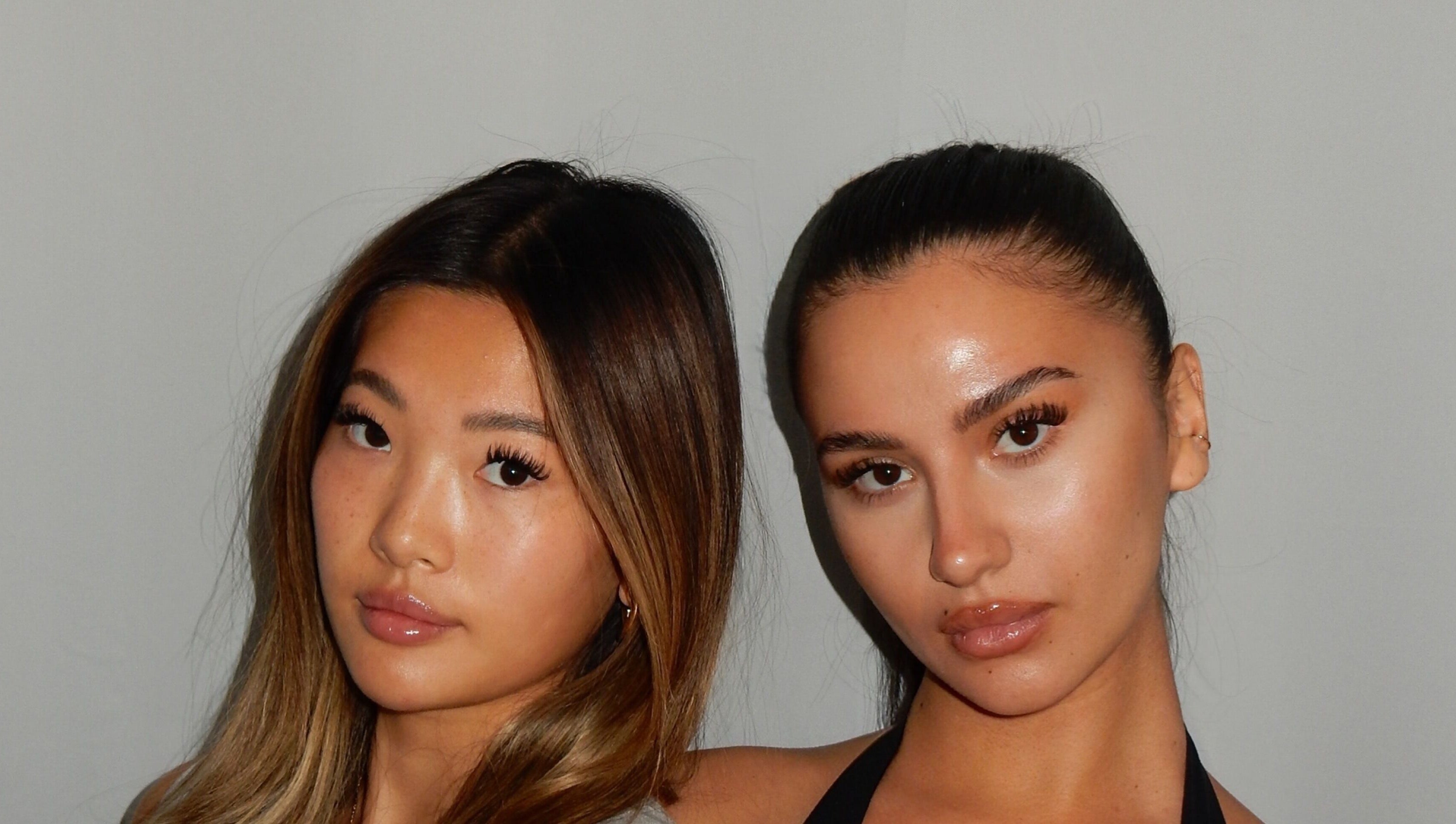 Two women showcasing eyelash extensions from Winksbyelise in Toronto, Ontario, CA for beauty enthusiasts.