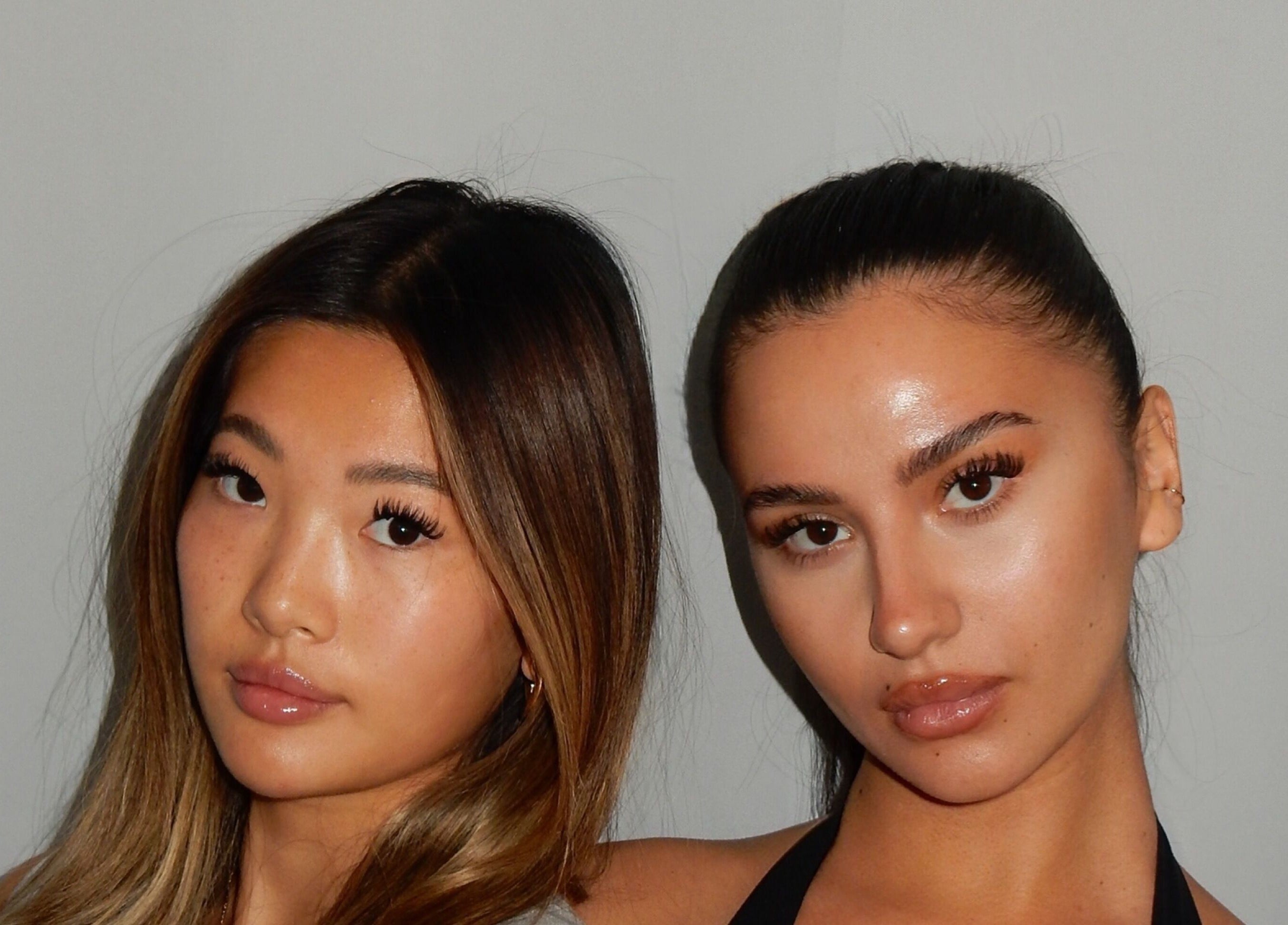 Two women showcasing eyelash extensions from Winksbyelise in Toronto, Ontario, CA for beauty enthusiasts.