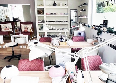 Elegant nail care setup at Fabulous Laboratory, Athina, Attici, GR with plush chairs and manicure tables.