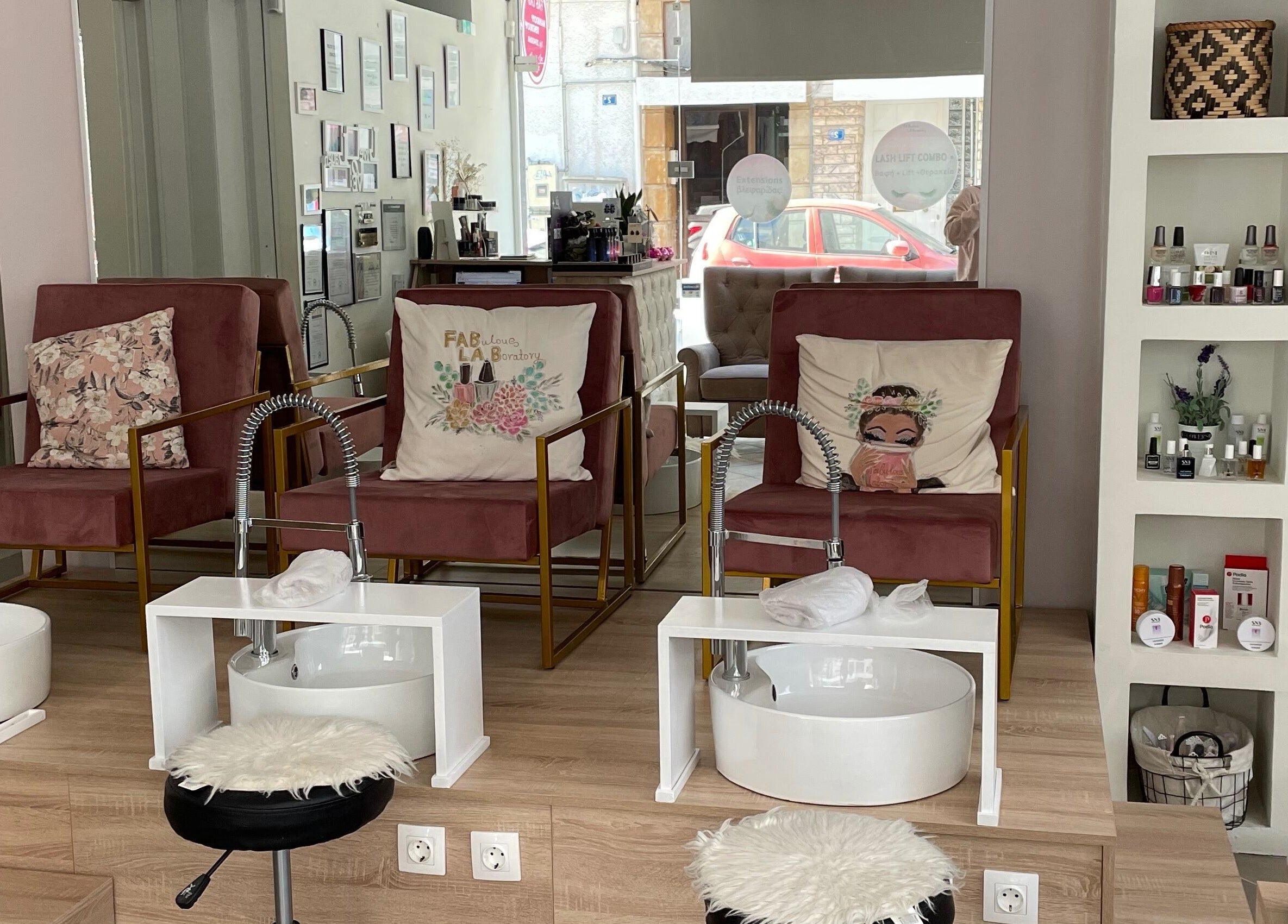 Stylish pedicure area at Fabulous Laboratory, Athina, Attici, GR with plush seating and nail polish display.