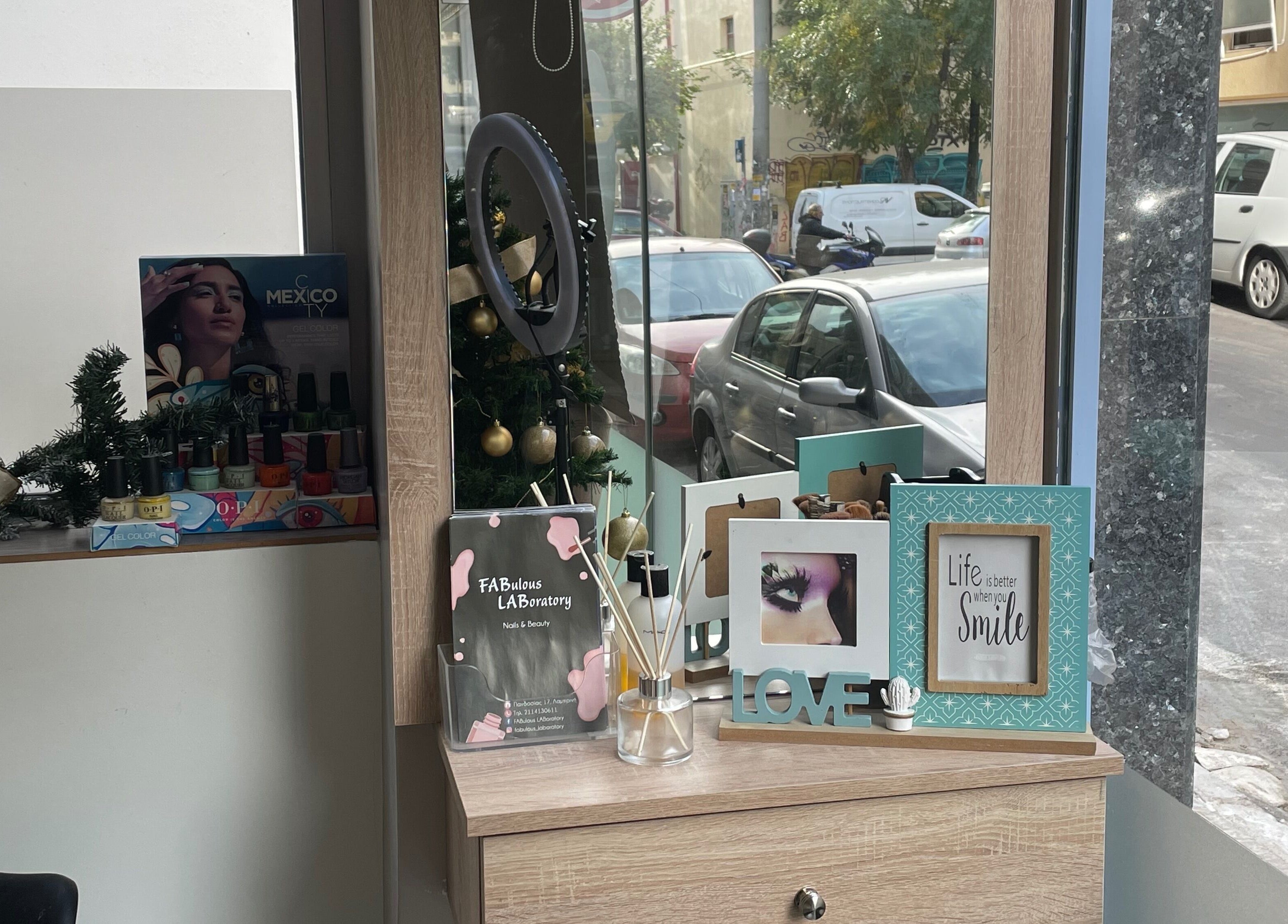 Decorative display at Fabulous Laboratory, Athina, Attici, GR, showcasing beauty products and holiday ornaments.