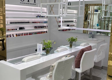Elegant nail salon at Lillia Beauty Lounge, Manama, Muḥāfaẓat al-ʿĀṣimah, BH, showcasing polished manicure stations.