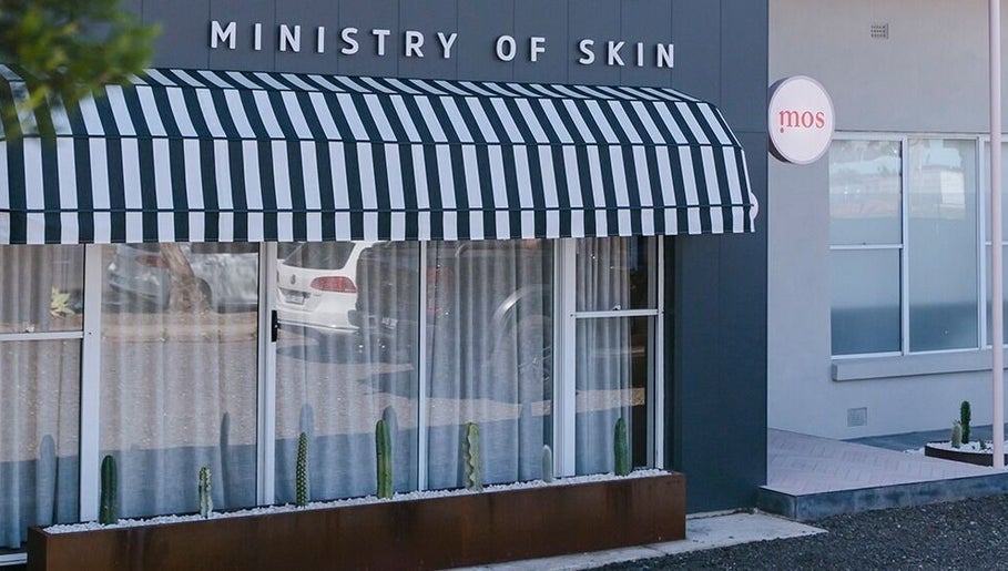 Front view of Ministry of Skin with striped awning in Torquay, Victoria, AU.