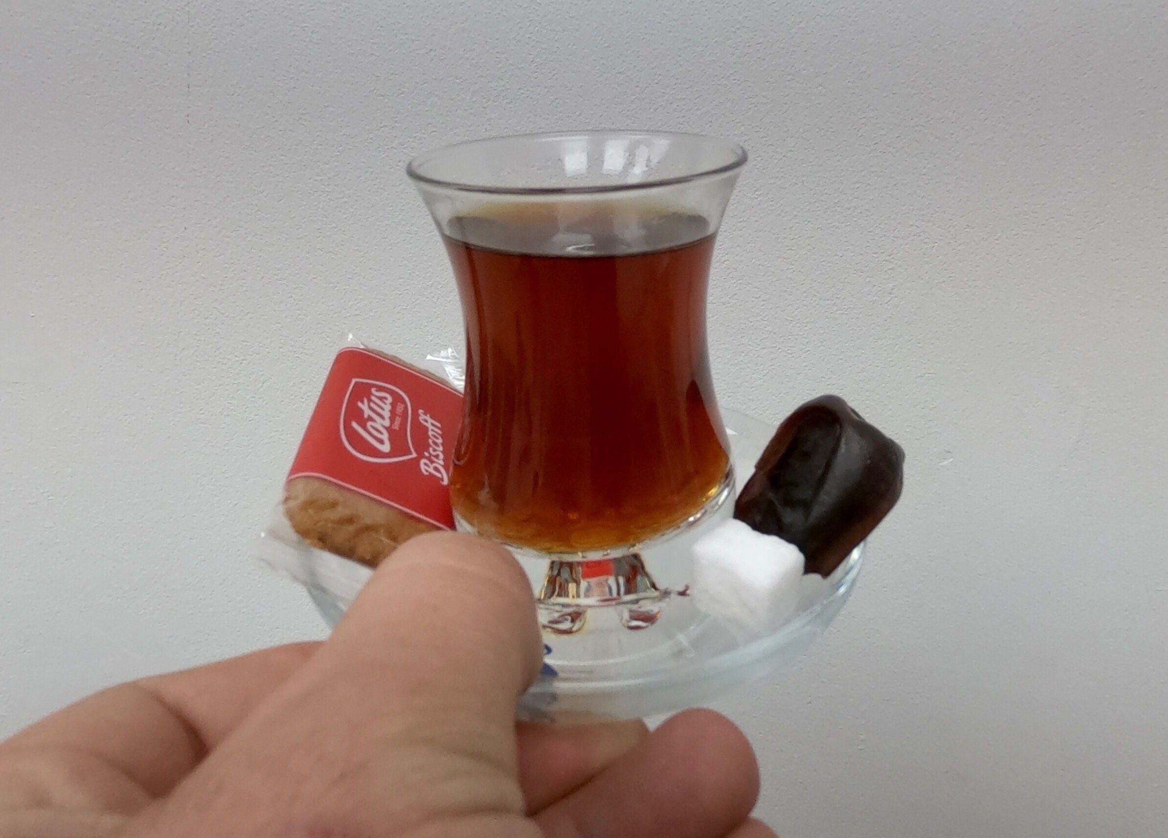 Tea, biscuit, and date served at Who’s Next Barbers, Littlehampton, England, GB.