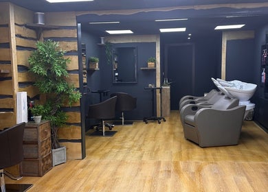 Comfortable salon interior at Bassu Wellness Salon & Store, Morpeth, England, GB with modern styling stations.