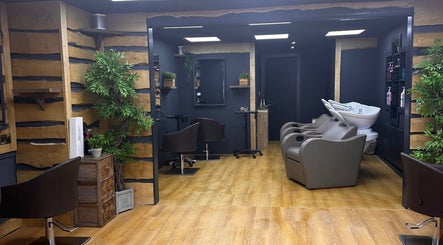Comfortable salon interior at Bassu Wellness Salon & Store, Morpeth, England, GB with modern styling stations.