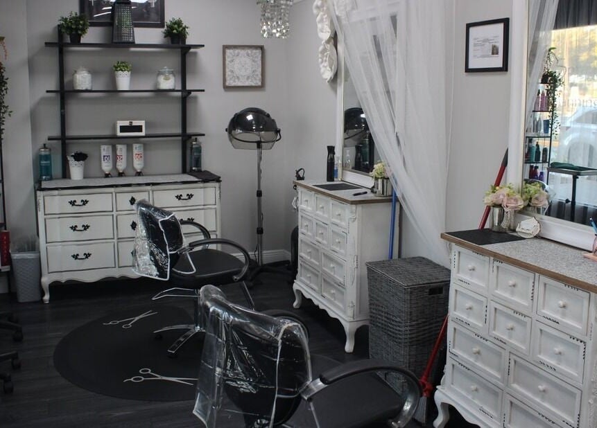 Elegant interior of Tanz Spa, Deltona, Florida, US featuring stylish salon chairs and vintage decor.