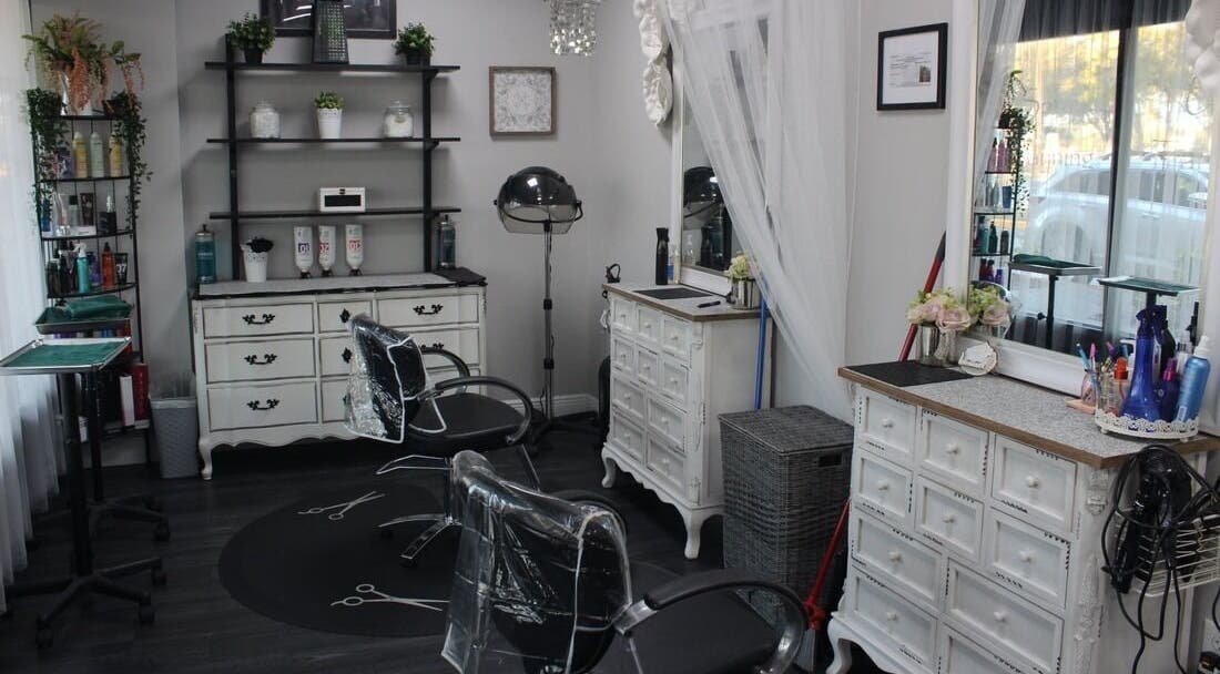 Elegant interior of Tanz Spa, Deltona, Florida, US featuring stylish salon chairs and vintage decor.