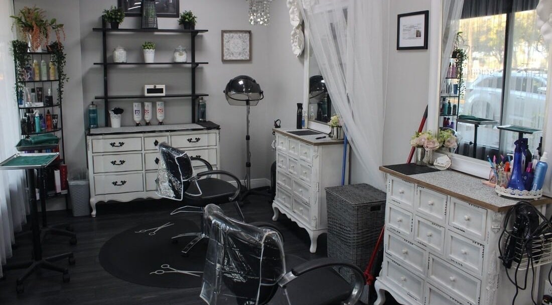 Elegant interior of Tanz Spa, Deltona, Florida, US featuring stylish salon chairs and vintage decor.