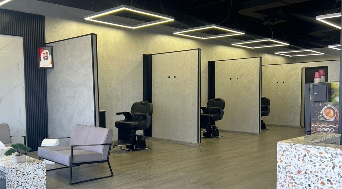 Modern interior of Retro Grooming Lounge for Men in Umm Al Quwain, AE with stylish barber chairs and decor.