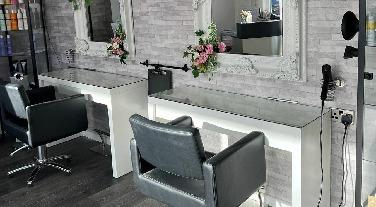 Modern styling area at Make Hair Magic, Gosport, England, GB, featuring sleek chairs and mirrors.