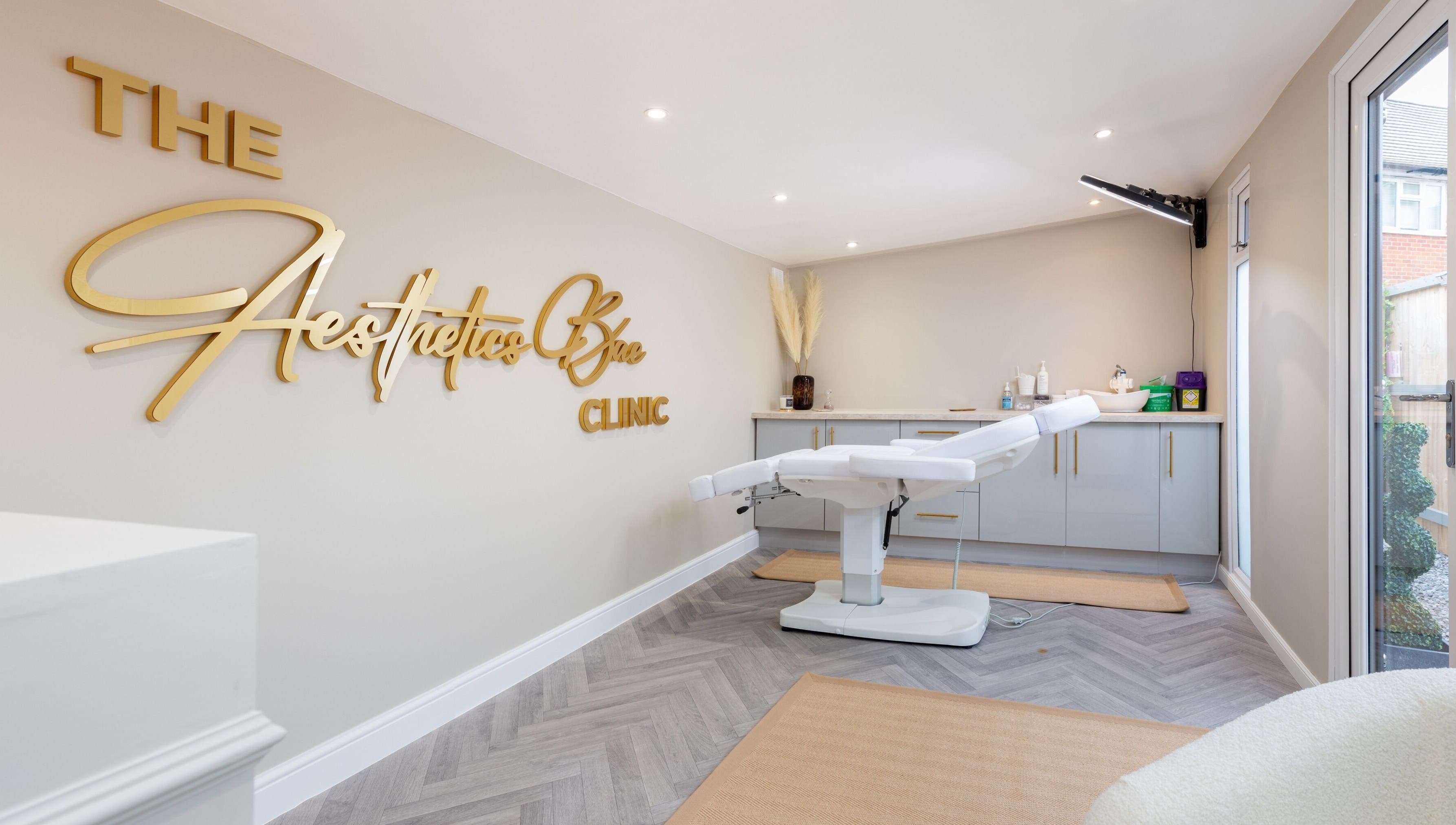Modern treatment room at The Aesthetics Bae Clinic - Winchester, Winchester, England, GB with sleek design.
