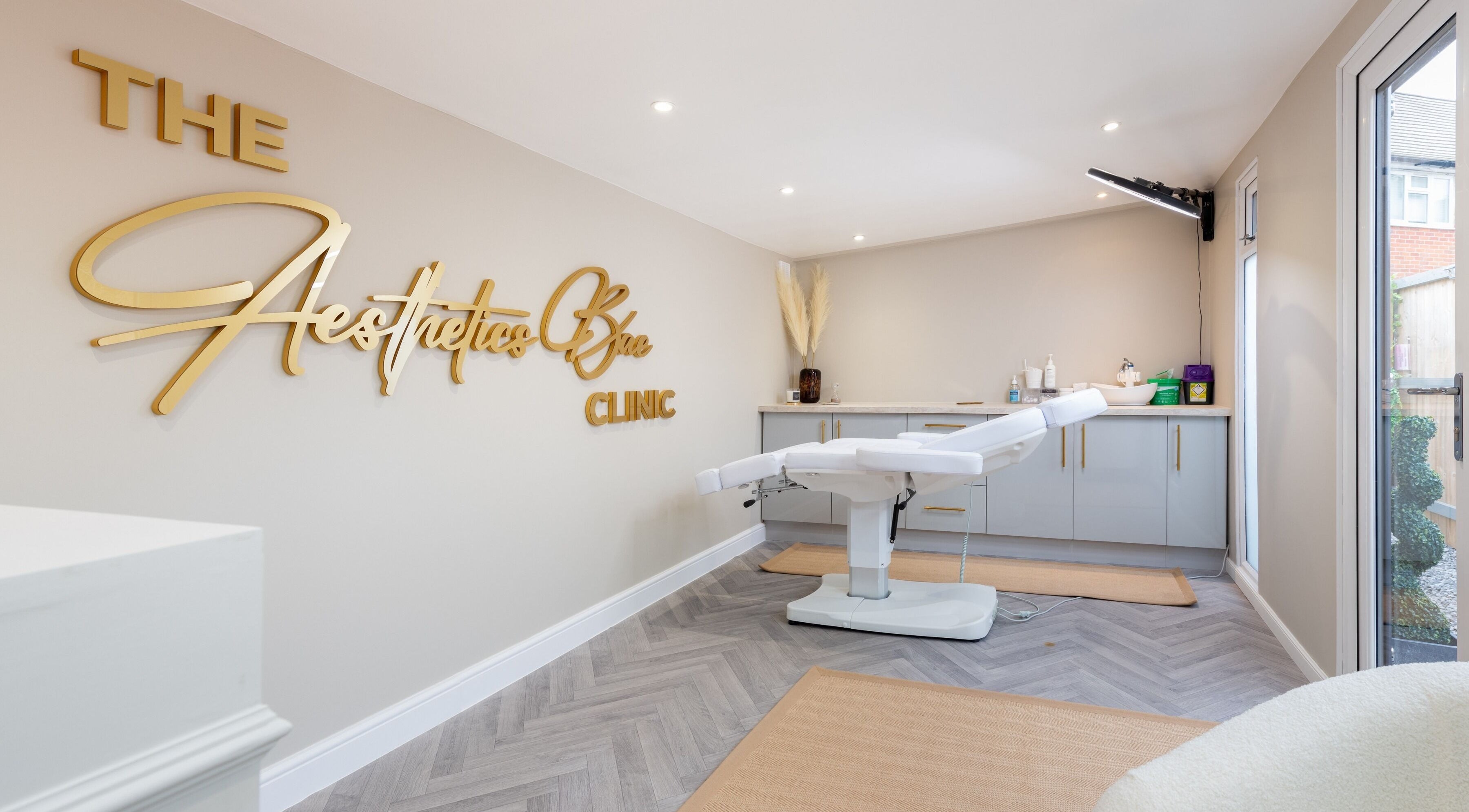 Modern treatment room at The Aesthetics Bae Clinic - Winchester, Winchester, England, GB with sleek design.
