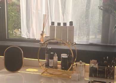 Elegant beauty counter at Bare Beauty, Stafford, England, GB with premium products and fresh flowers.
