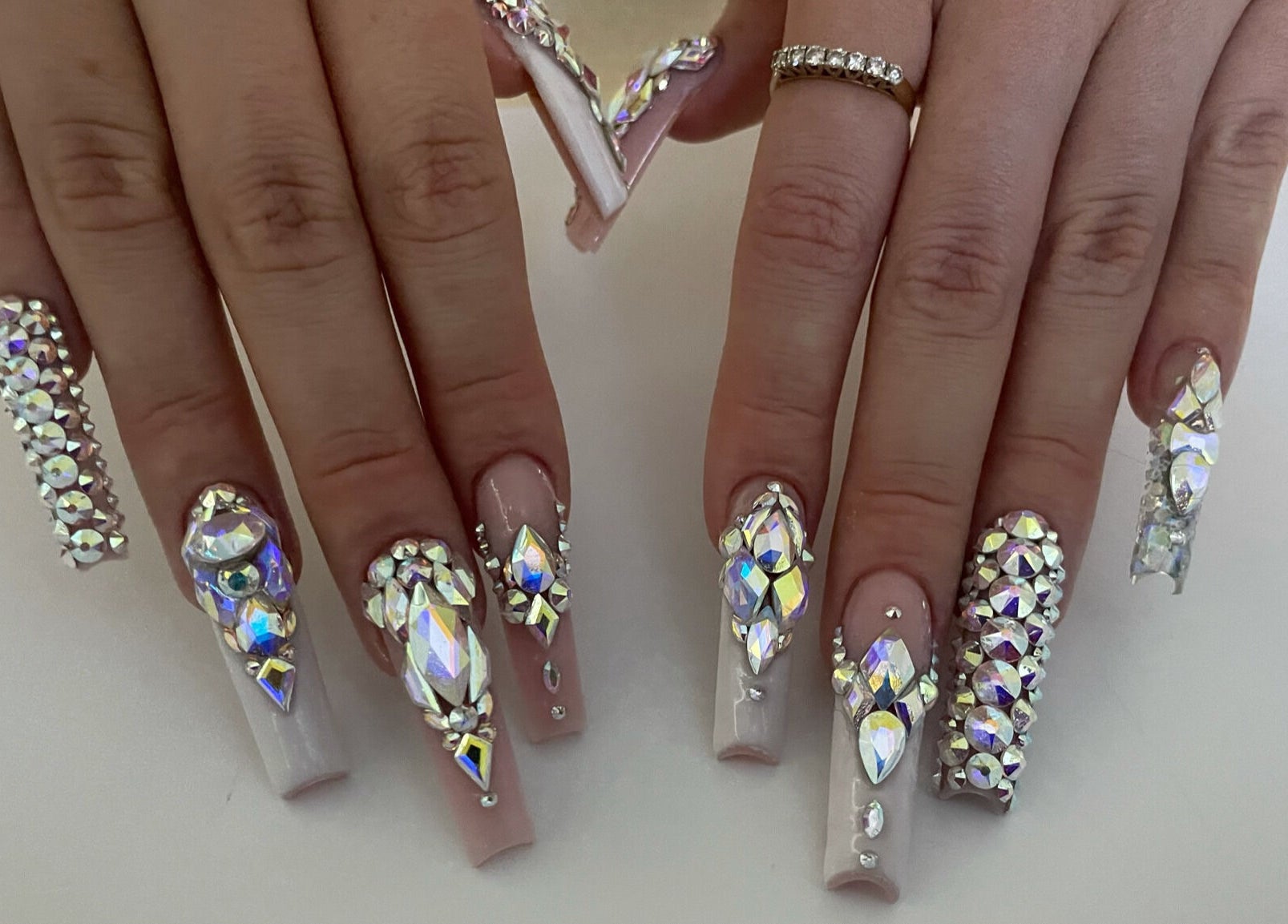 Glamorous crystal-encrusted nails at Classy Claws in Vancouver, British Columbia, CA.