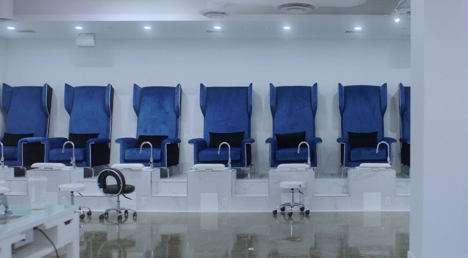 Luxurious blue pedicure chairs at Classy Claws, Vancouver, British Columbia, CA, for ultimate relaxation.