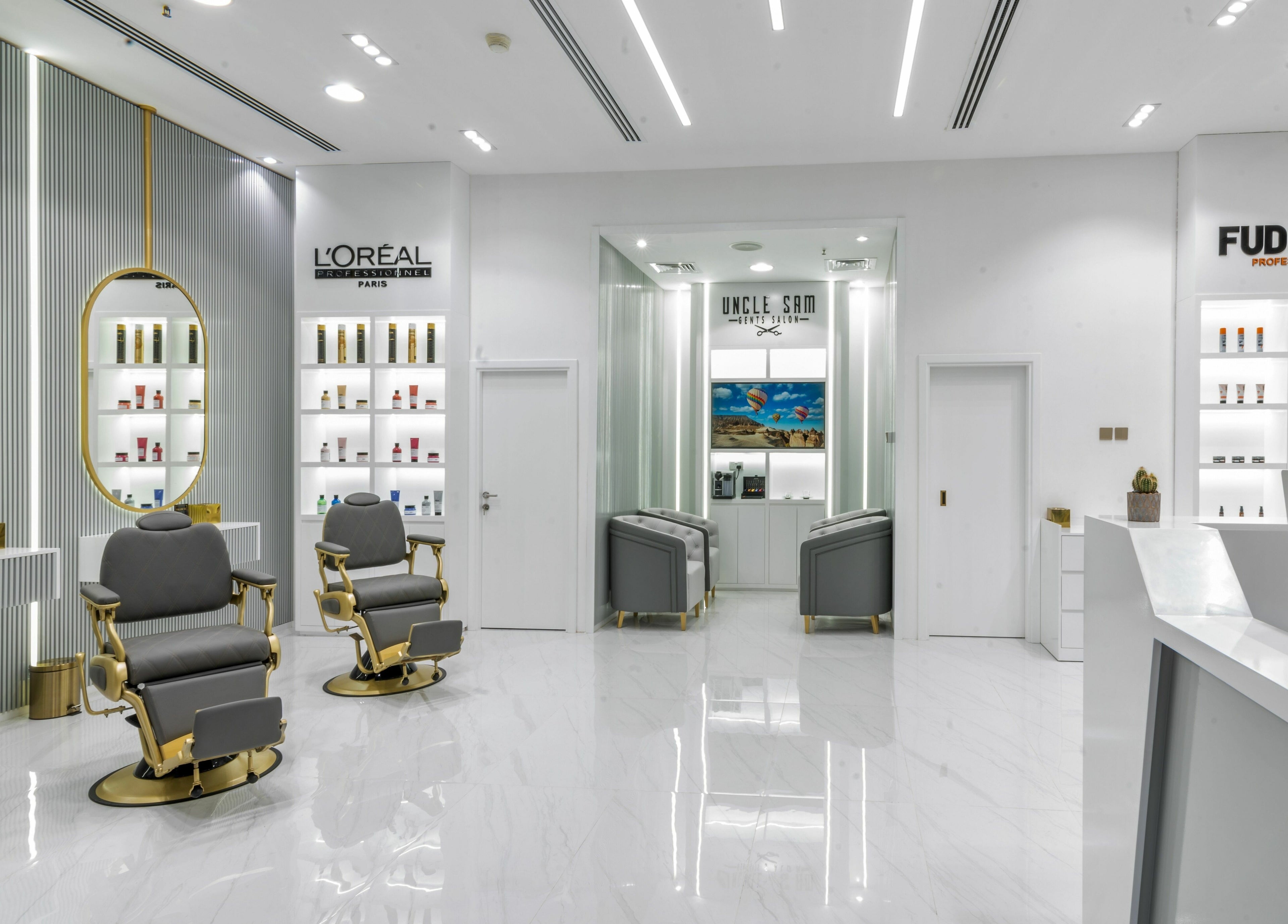 Elegant interior of Uncle SAM Gents Salon in Dubaï, Dubaï, AE featuring styling chairs and modern decor.