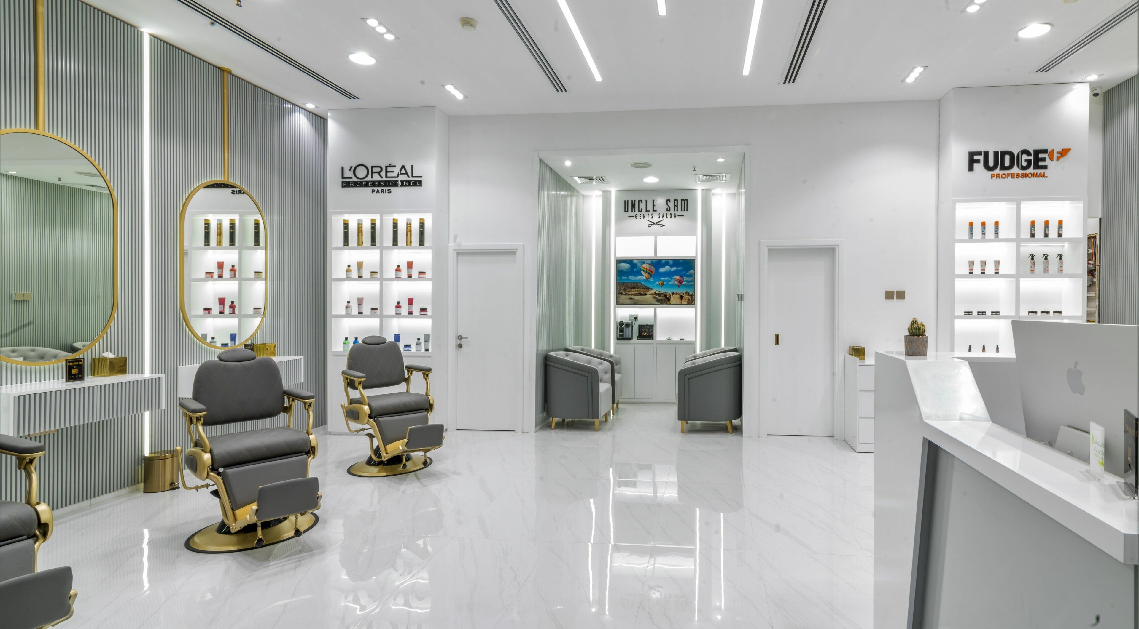 Elegant interior of Uncle SAM Gents Salon in Dubaï, Dubaï, AE featuring styling chairs and modern decor.