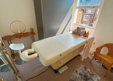 Cozy massage room at Leme Personal Therapy - MALE Massage & Spa, London, England, GB, with a massage table and decor.