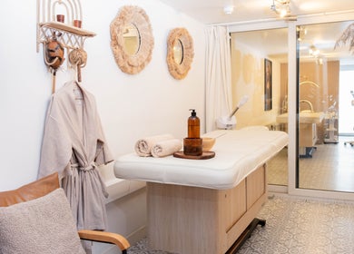 Cozy massage room at Studio Leme - Male Massage & Spa, London, England, GB features elegant decor and massage table.