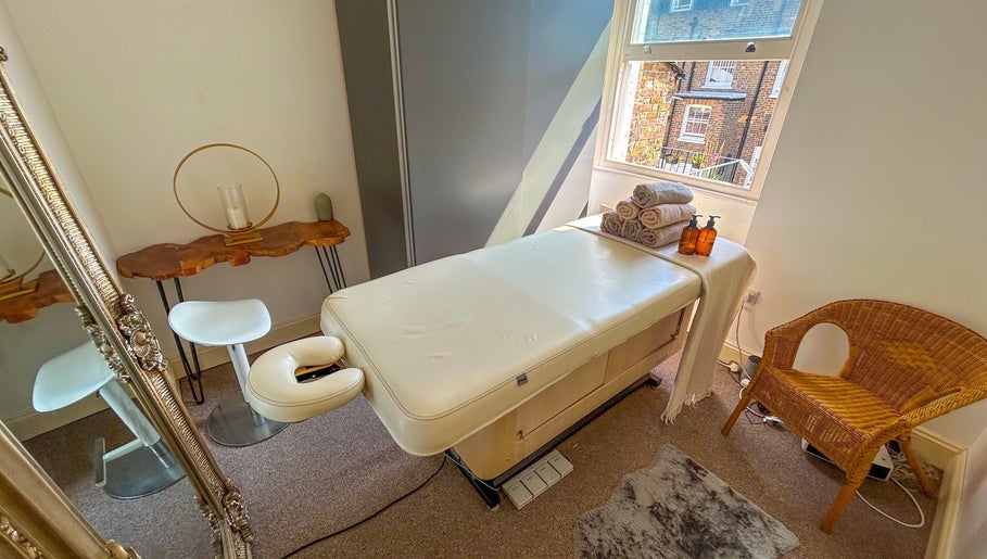 Relaxing massage room at Leme Personal Therapy - MALE Massage & Spa, London, England, GB with a massage bed.