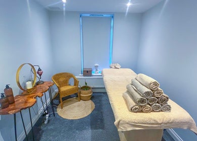 Tranquil therapy room at Leme Personal Therapy, London, England, GB, featuring a massage table and cozy decor.