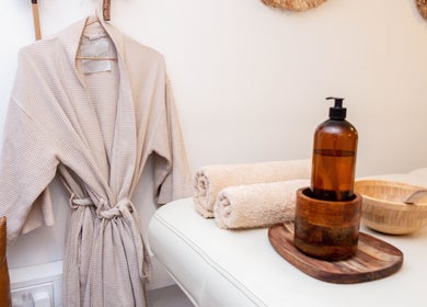 Luxurious spa setting at STUDIO LEME - Massage, Grooming & Spa in London, England, GB with cozy robe and essentials.