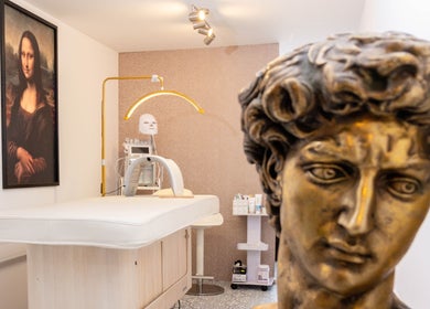 Massage room at STUDIO LEME - Massage, Grooming & Spa, London, with art and classic decor.