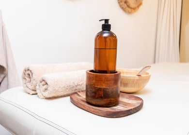 Relaxing spa setup at STUDIO LEME - Massage, Grooming & Spa, London, England, GB with towels and essentials.