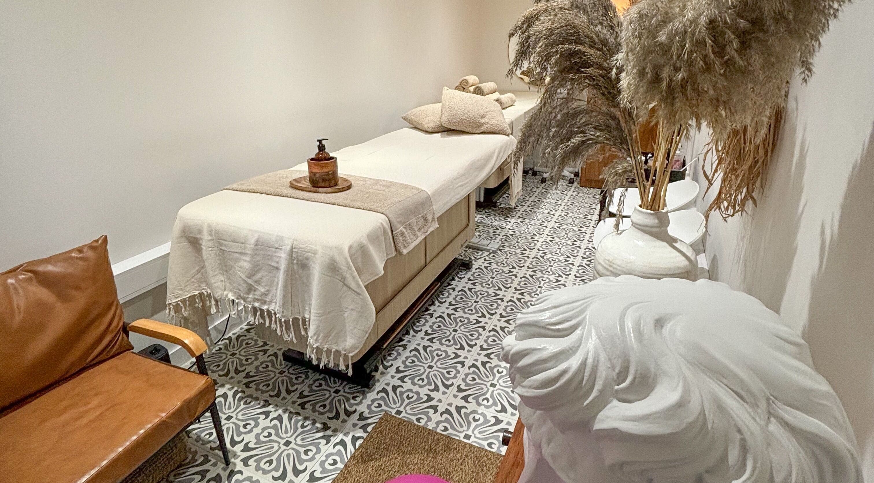 Relaxing massage room at STUDIO LEME - Massage, Grooming & Spa, London, England, GB with elegant decor.