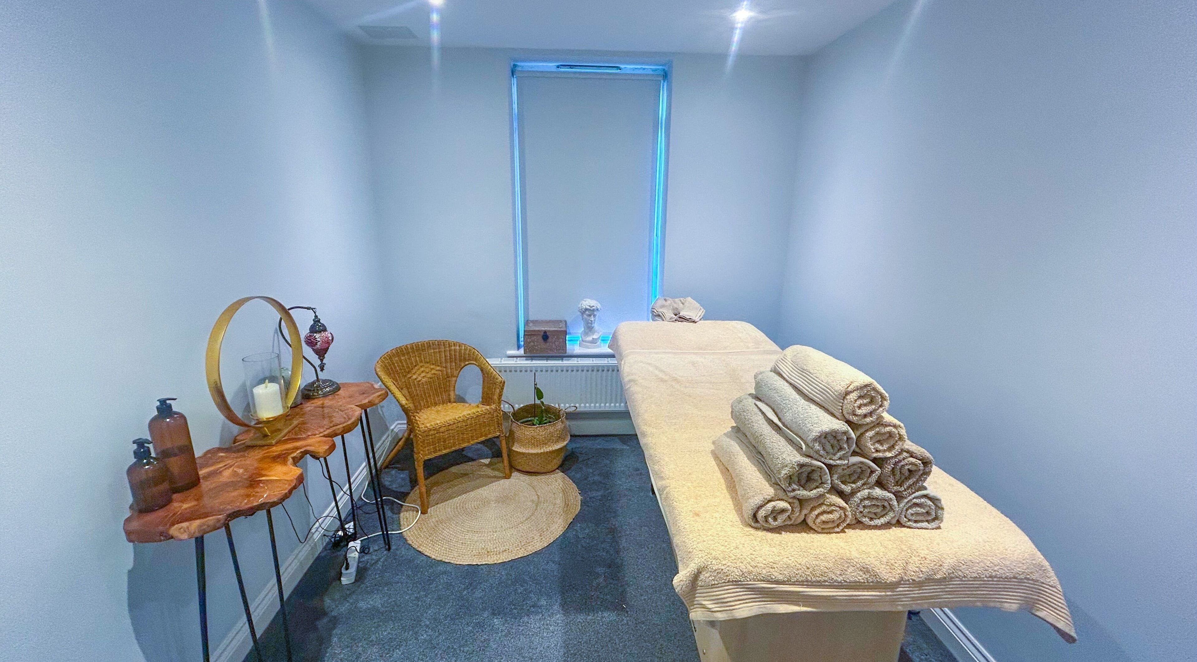Calm therapy room at Leme Personal Therapy, London, England, GB. Features massage table and natural decor.