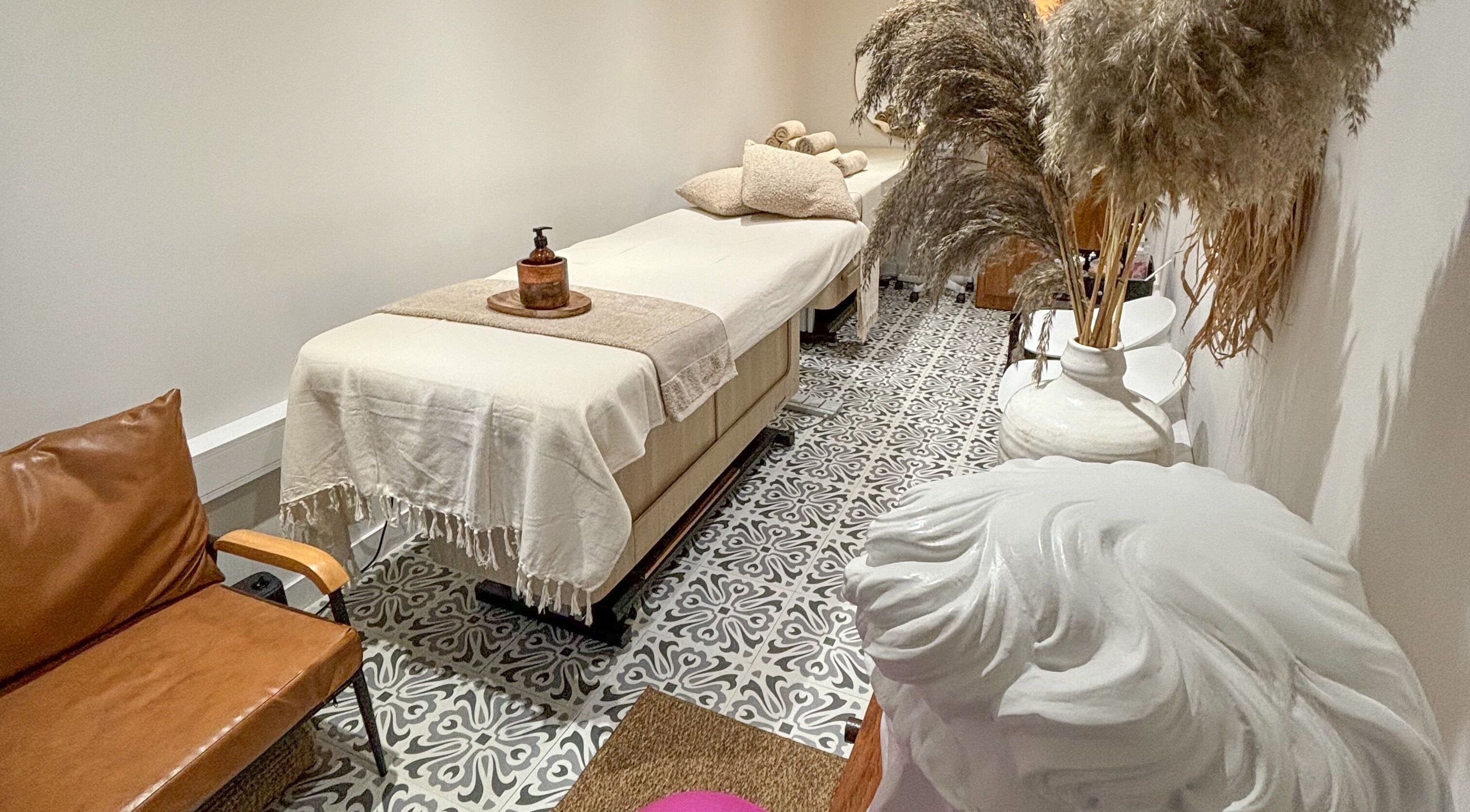 Tranquil massage room at Studio Leme - Massage, Grooming & Spa, London, England, GB, with earthy decor.