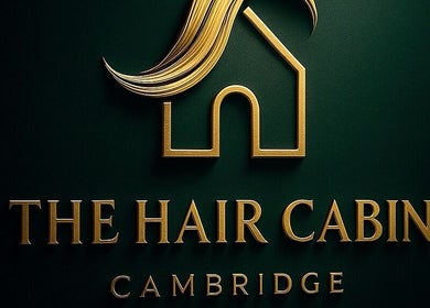 Golden logo of The Hair Cabin, Cambridge, England, GB on a dark background.
