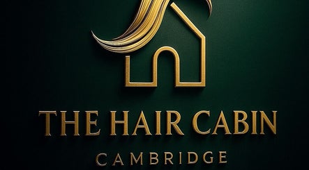 Golden logo of The Hair Cabin, Cambridge, England, GB on a dark background.